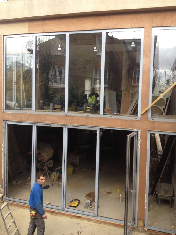 Aluminium bi-fold doors with two-storey glazing in Balham
