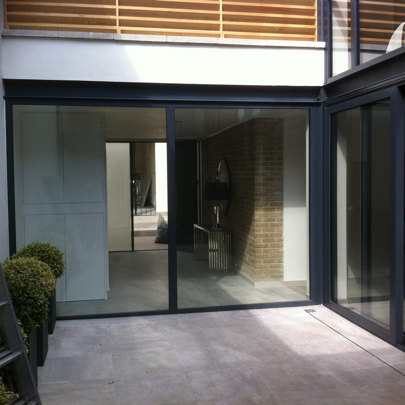 Floor-to-ceiling sliding doors opening to courtyard in Balham