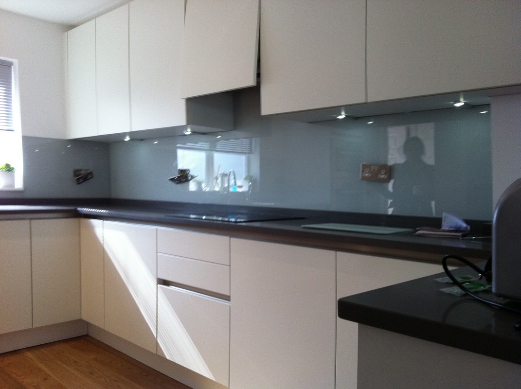Grey glass kitchen splashback with LED lighting in Balham