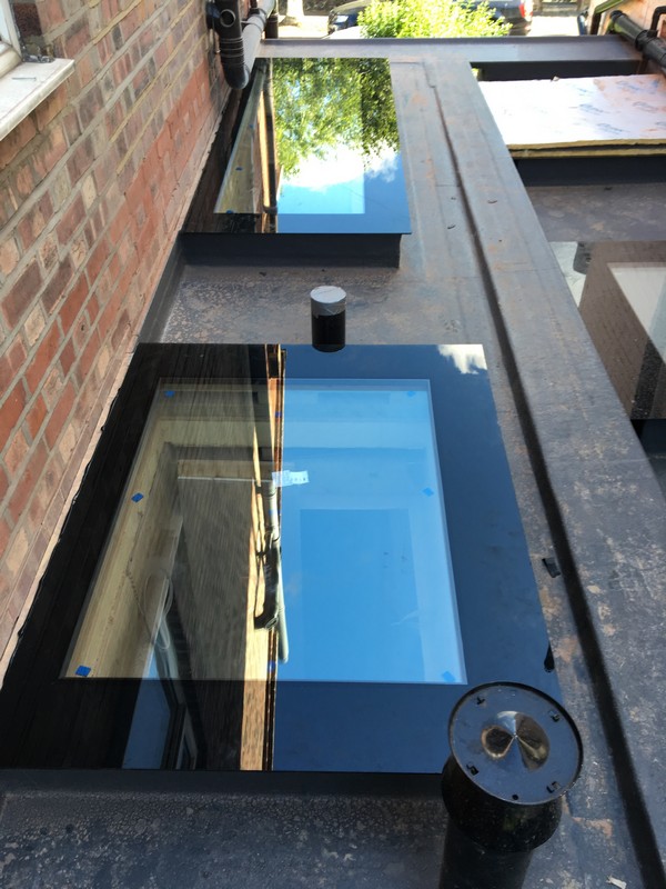 Multiple flat roof skylights on extension in Balham